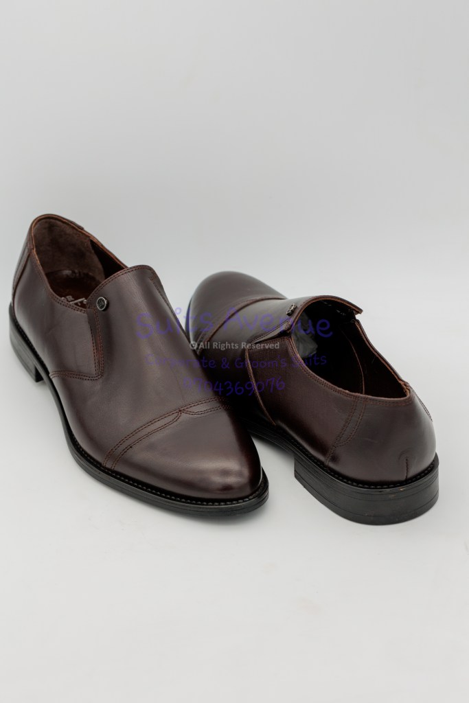"Close-up of Suits Avenue's 550k Ugx 100% Leather Shoes showcasing its exquisite craftsmanship and polished finish."