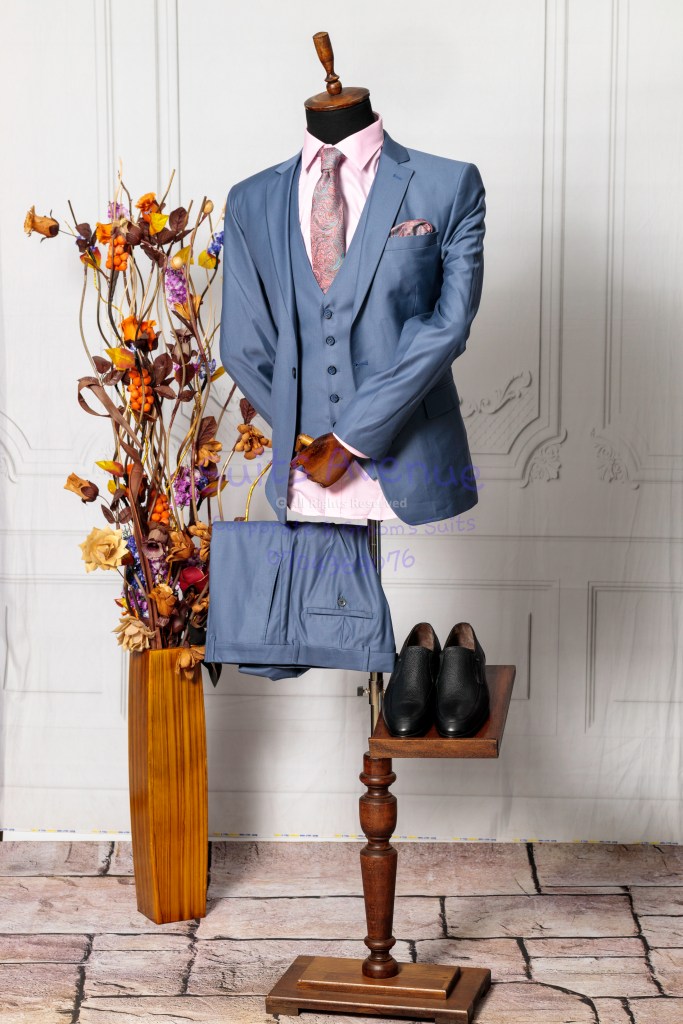Man in a sleek wool blend suit, exuding confidence and elegance.