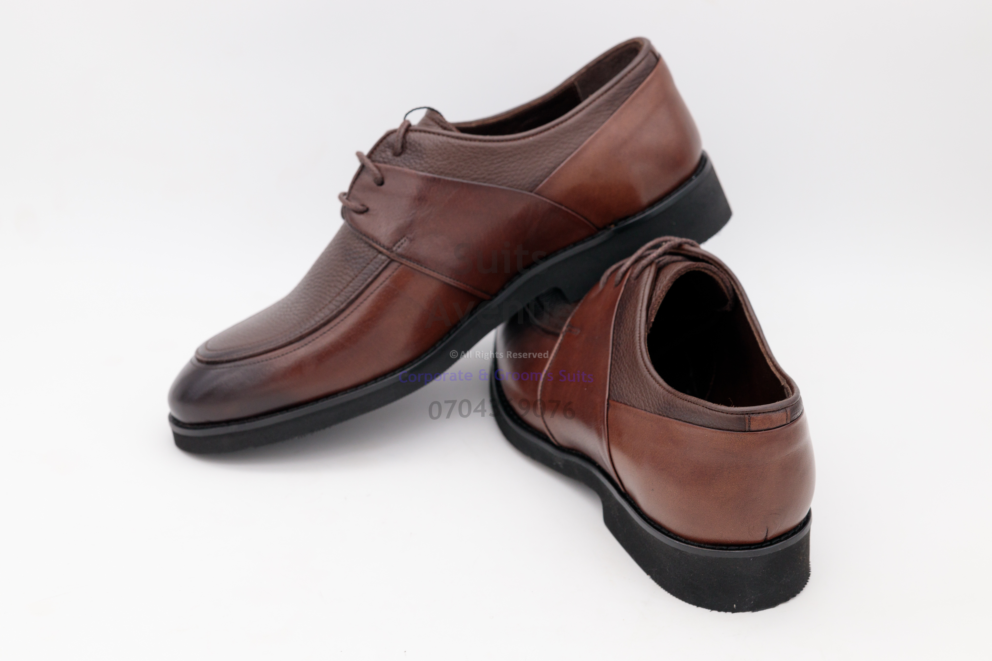 A pair of sleek slip-on leather shoes crafted from 100% leather, designed for comfort and quick style transitions.