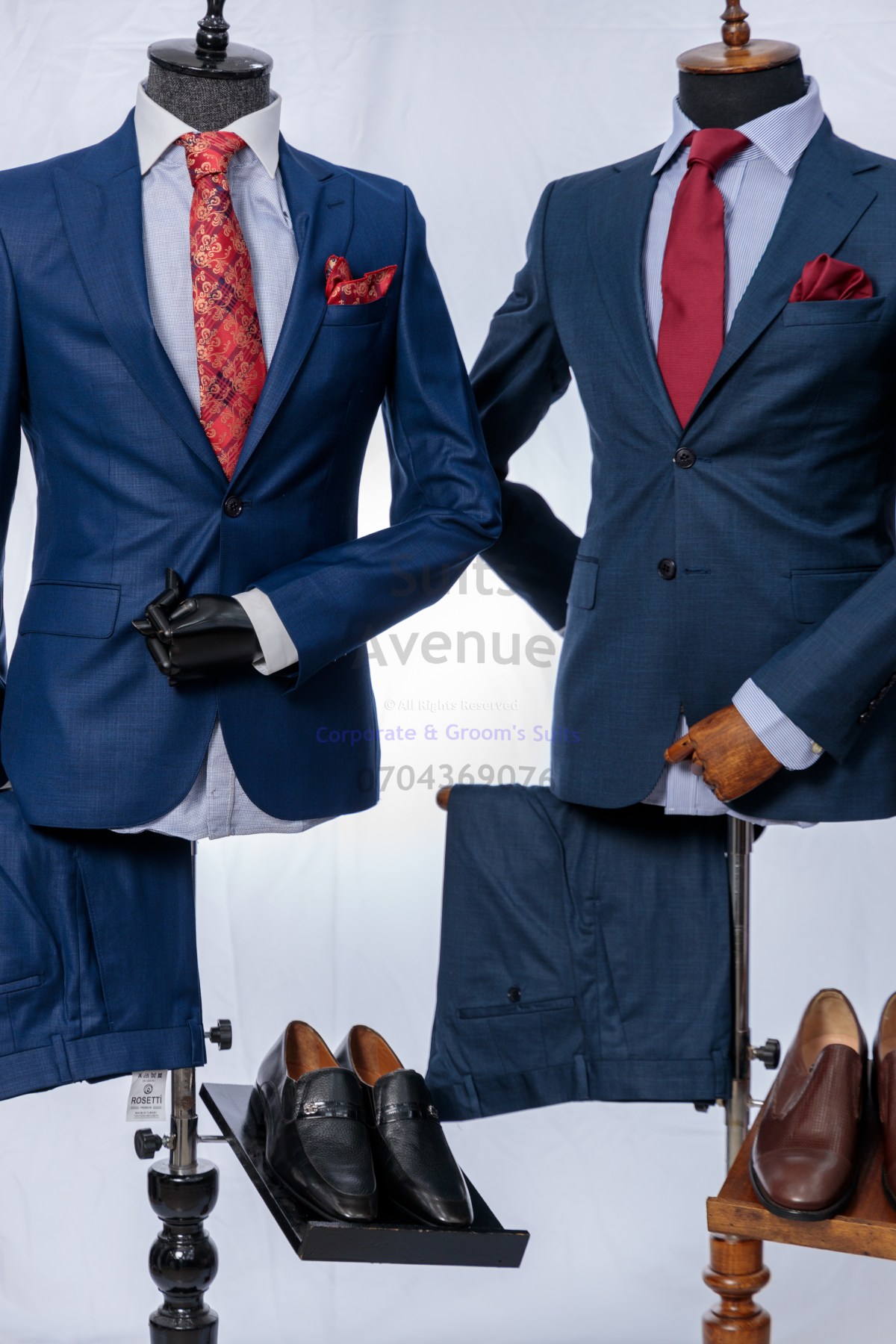 Man wearing a navy blue corporate suit ideal for professional settings in Kampala