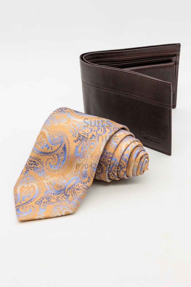 Burgundy floral silk tie styled with a grey suit and white shirt, perfect for Kampala weddings.