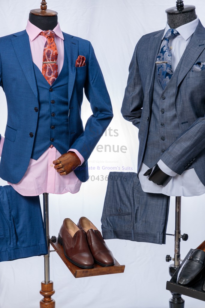 Man wearing a blue wool blended corporate suit, perfect for professional and formal occasions in Kampala