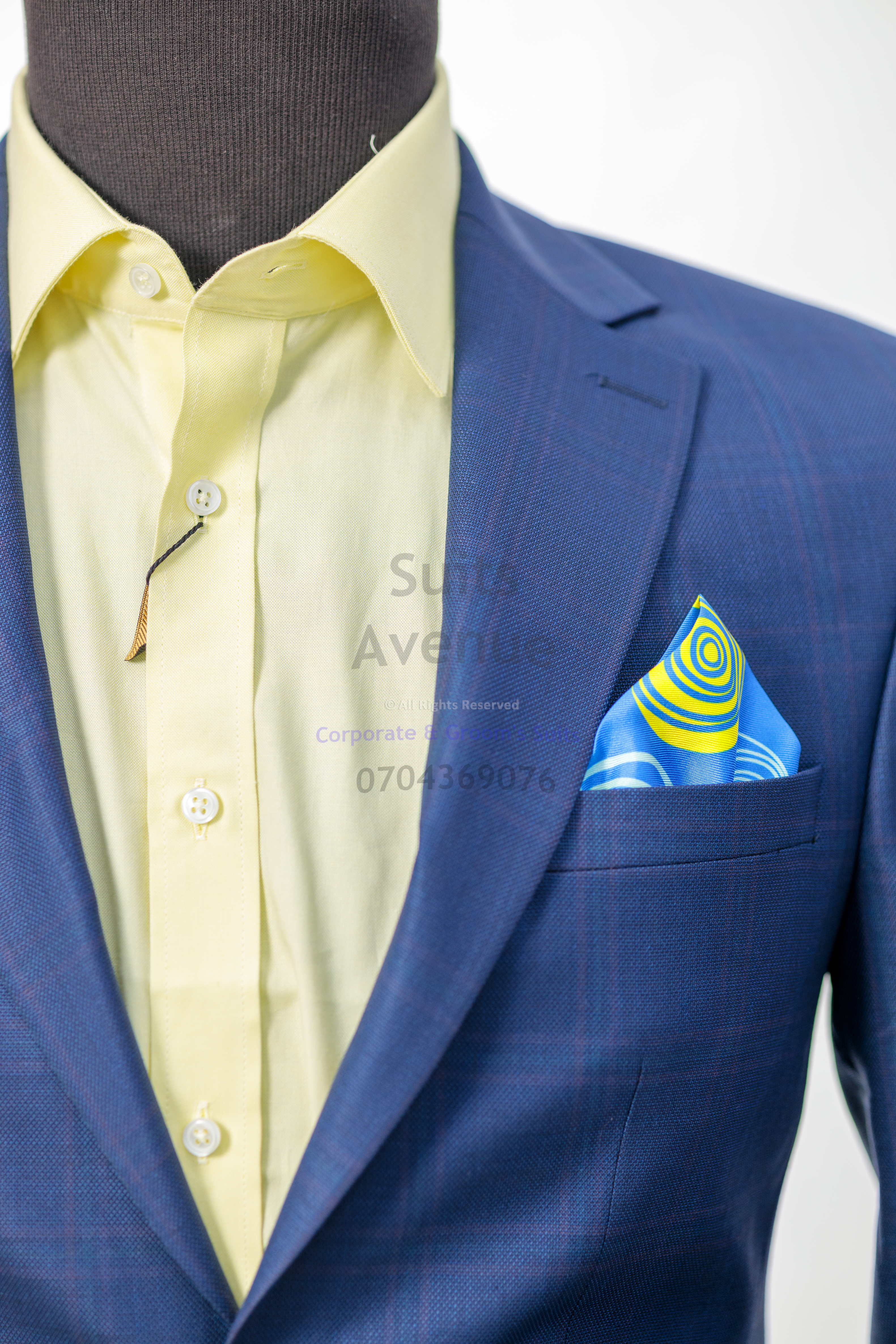 **Q: What is the most important thing to check when buying an office blazer?**
A: Fit at the shoulders and chest. If those are right, everything else is easier to adjust.

**Q: How should a blazer feel when I button it?**
A: It should close smoothly without strain or an “X” pull across the front.

**Q: Can I wear a blazer every day in Kampala?**
A: Yes, if you choose a breathable fabric and a comfortable fit for your routine.

**Q: Which blazer colours are safest for a professional office look?**
A: Colours that pair easily with many shirts and trousers and look formal in meetings.

**Q: Should I choose a plain blazer or a patterned one for work?**
A: Plain or subtle patterns are safer for daily office wear because they match more outfits.

**Q: How long should blazer sleeves be?**
A: Around the wrist bone, with a neat finish so your shirt sits clean underneath.

**Q: What shirt works best under an office blazer?**
A: A shirt with a structured collar and a clean fit so the outfit stays sharp all day.

**Q: How many office blazers should I start with?**
A: Start with one versatile blazer that matches several outfits, then add another once you know what you wear most. — Part 3