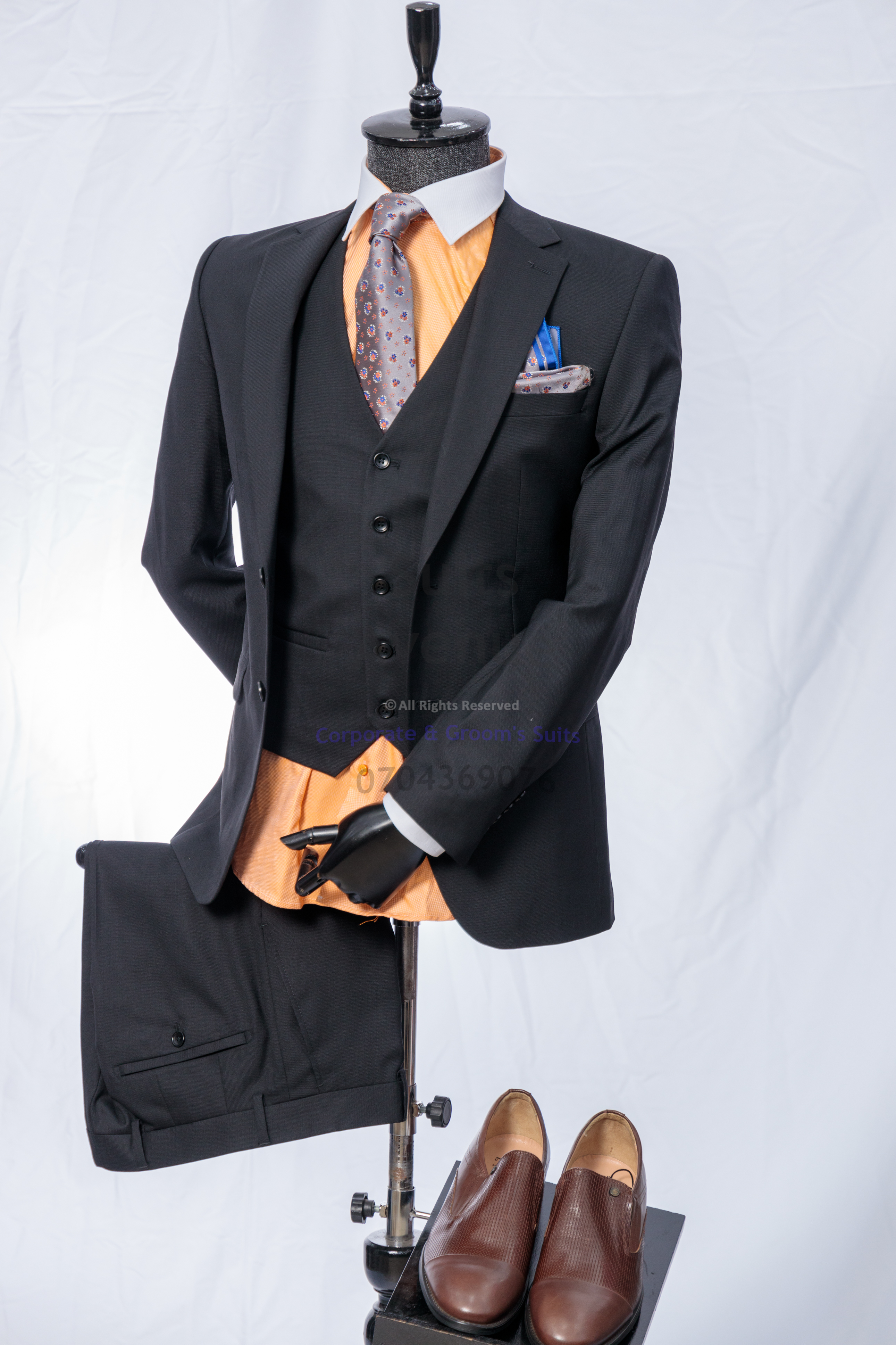 ## Quick Checklist: Your 5-Suit Rule Plan (Plus Buying Tips)
Use this checklist to keep your choices focused:
- Choose **two dark suits** (navy and charcoal)
- Add **one mid-tone** (medium grey)
- Add **one light option** (light grey or tan)
- Add **one formal/personality suit** (subtle pattern or deeper tone)
- Prioritise **fit and comfort** for long workdays
- Rotate wear to give each suit **time to rest**

### Buying and styling tips that keep the rotation easy
- Keep shirts simple: white and light blue will cover most days.
- Keep shoes consistent: black for formal, dark brown for flexibility.
- Keep patterns controlled: if one suit is patterned, let the other four stay solid.

This article helps you choose the right wool grade so your five-suit rotation balances comfort, durability, and daily wear. https://suitsavenue.blog/super-180s-vs-100s-wool/

Click the WhatsApp button to speak with Suits Avenue and get help choosing the right piece. — Part 3