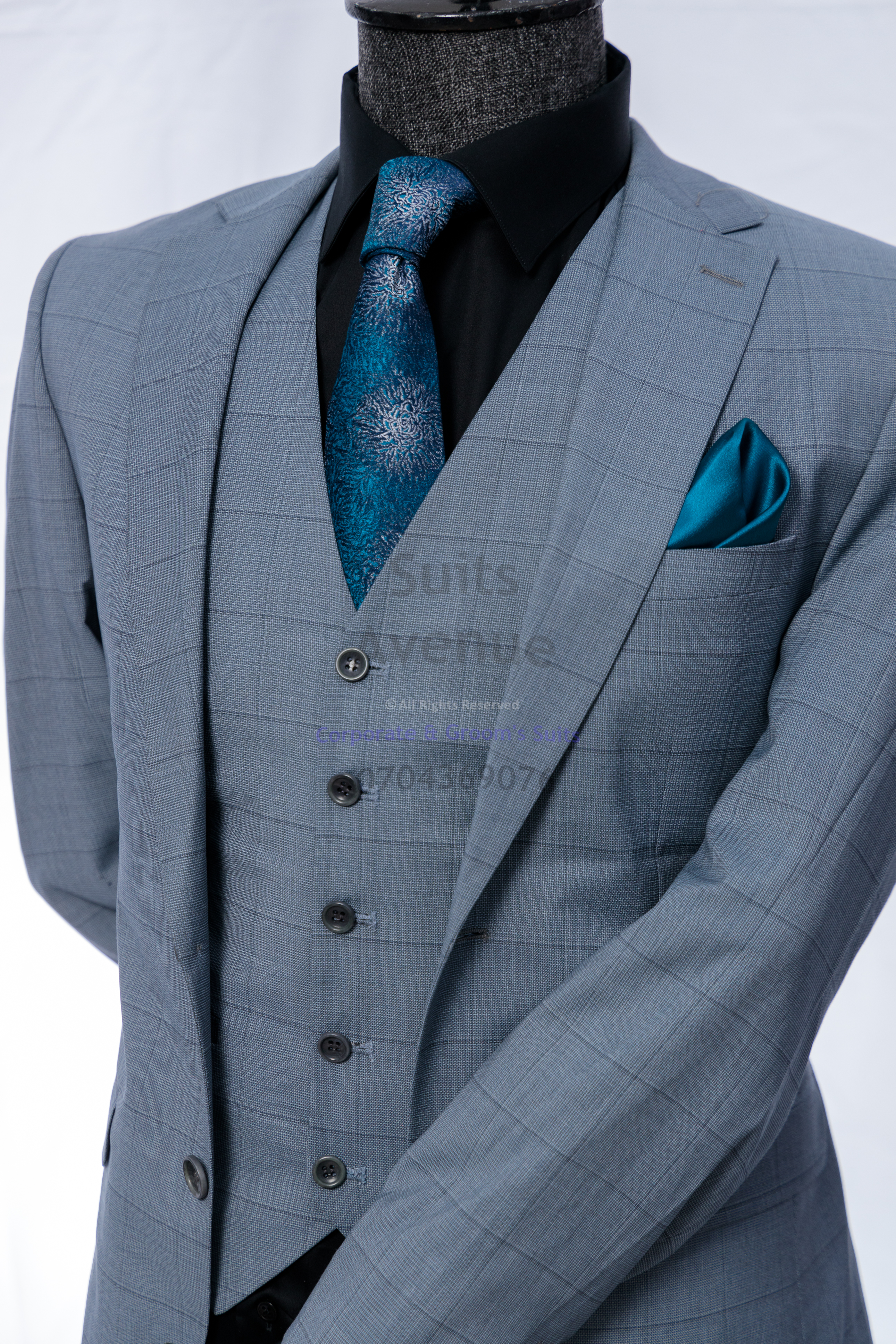 ## Quick Checklist for Dressing Well in Kampala Offices
Before you leave home, use this simple checklist:
- Suit colour is office-safe (navy, charcoal, grey)
- Fabric feels comfortable for the day
- Jacket fits cleanly at the shoulders and chest
- Trousers sit well and break neatly at the shoe
- Shirt is clean, pressed, and simple
- Shoes are polished; belt matches
- You look neat from head to toe (hair, nails, overall grooming)

If you are building a small suit wardrobe for Kampala work, start with one navy suit and one charcoal suit. From there, add shirts in white and light blue, plus two ties that work with both suits. This keeps your choices easy while still looking sharp.

Click the WhatsApp button to speak with Suits Avenue and get help choosing the right piece. — Part 3