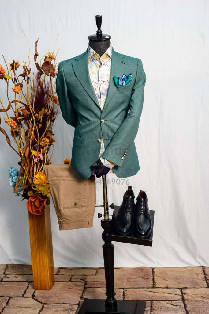 - Why a blazer is a smart casual essential in Kampala
- Start with the right fit: shoulders, chest, waist, and length
- Choose fabric for comfort in Kampala weather
- Pick a versatile color and simple details
- Easy pairings: shirts, polos, trousers, jeans, and shoes
- Common blazer mistakes to avoid
- Quick checklist and next steps before you buy — Part 3 **Q: Can I wear a blazer casually in Kampala?**
A: Yes. Choose a comfortable fabric, a clean fit, and pair it with a polo or simple shirt and neat trousers or dark jeans.
**Q: What is the biggest sign a blazer does not fit well?**
A: Poor shoulder fit. If the shoulder line drops or pinches, the blazer will not look clean even if everything else seems fine.
**Q: Should a casual blazer be tight or relaxed?**
A: It should be neat but comfortable. You want shape without pulling at the buttons or restricting your arms.
**Q: Which blazer color is most versatile for daily wear?**
A: Navy and charcoal are strong choices because they pair easily with many shirt and trouser colors.
**Q: Can I wear a blazer with jeans?**
A: Yes. Choose dark, clean jeans and keep the rest of the outfit simple and well-fitted.
**Q: What shoes work best with a casual blazer?**
A: Loafers, clean leather shoes, or neat minimal sneakers can work depending on where you are going.
**Q: How do I keep my blazer looking sharp during the day?**
A: Choose a fabric that holds shape, avoid overloading the pockets, and hang it properly when you are not wearing it.
**Q: Do I need a full suit if I only want to look smart casual?**
A: Not necessarily. A blazer with matching or well-paired trousers can give you a polished look without a full suit. — Part 3