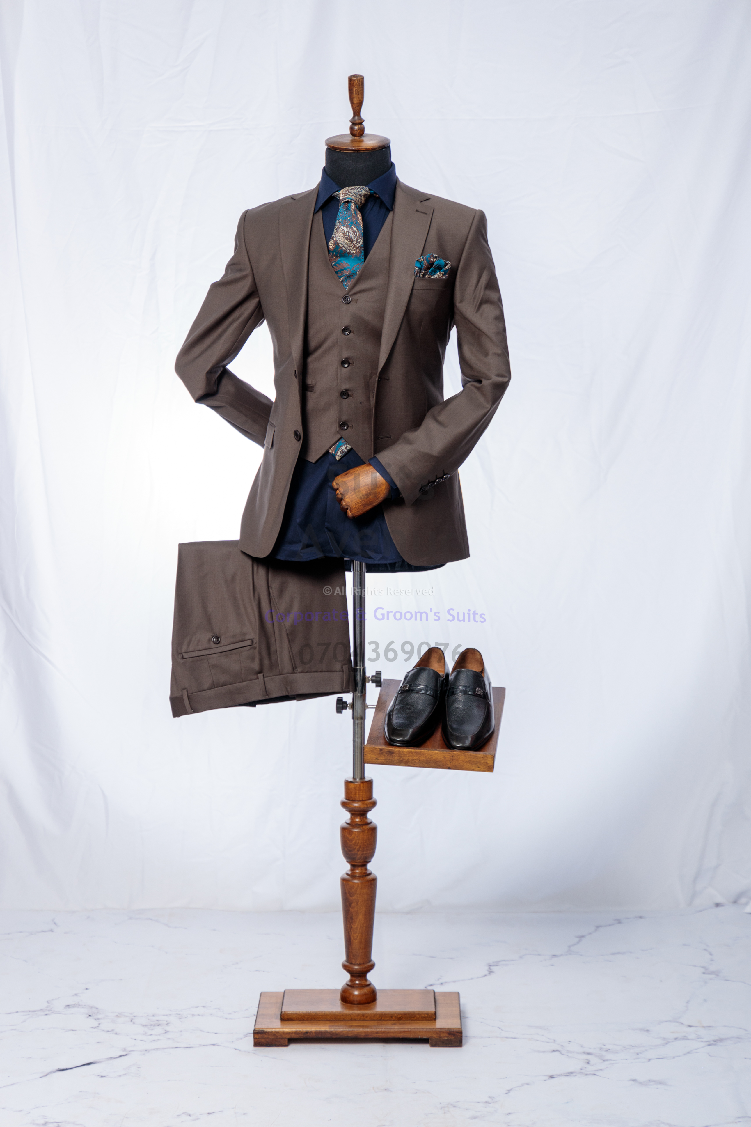 ## Quick Checklist Before You Buy Your Next Wool Suit
Use this final checklist to keep your choice simple and correct:

- Fit: shoulders sit clean, jacket does not pull when buttoned, sleeves and trousers look balanced
- Comfort: you can sit, walk, and raise your arms without strain
- Wool weight: suits your real Kampala schedule (meetings, travel, indoor/outdoor time)
- Quality: cloth feels refined and holds shape, not just “soft” on the first touch
- Colour: navy, charcoal, or grey for the most professional and repeatable looks
- Tailoring: plan for small adjustments to finish the fit

If you want to go deeper on fabric numbers and what they mean in real life, use this guide to understand wool numbers and fabric feel, so you can pick the right weight and finish for office wear in Kampala. https://suitsavenue.blog/super-180s-vs-100s-wool/

Click the WhatsApp button to speak with Suits Avenue and get help choosing the right piece. — Part 3