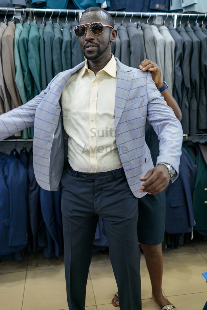 **Q: Can I wear a blazer with a T-shirt in Kampala?**
A: Yes. Keep the T-shirt plain, fitted (not tight), and clean, and pair it with dark jeans or chinos.

**Q: What blazer color is safest for weekends?**
A: Navy is the easiest. It works with jeans, chinos, and most shirt colors.

**Q: How do I avoid looking like I am going to the office?**
A: Skip the tie, choose a more casual fabric, and wear relaxed shoes like loafers or clean minimal sneakers.

**Q: Are jeans acceptable with a blazer for weekend plans?**
A: Yes, if the jeans are dark, clean, and well-fitted. Avoid ripped or overly faded styles.

**Q: What shoes make a blazer look too formal?**
A: Very shiny dress shoes and very pointed formal shoes often push the outfit into business territory.

**Q: Can I wear a blazer to church on Sunday?**
A: Yes. Choose a clean, well-fitted blazer and pair it with tailored trousers or neat chinos for a respectful, smart look.

**Q: What is the biggest fit mistake with weekend blazers?**
A: A blazer that is too tight in the chest and arms. It looks stiff and feels uncomfortable.

**Q: Do I need a pocket square on weekends?**
A: Not necessary. If you use one, keep it simple and understated. — Part 3