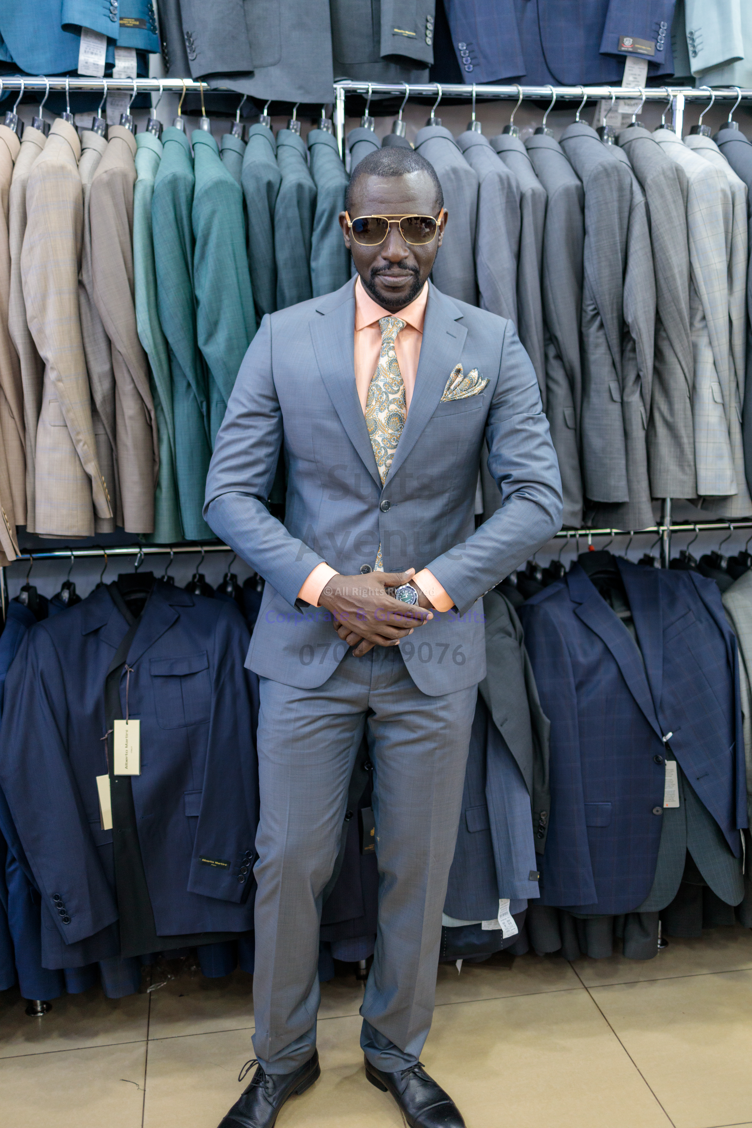 ## Quick checklist, simple styling tips, and next step
### Quick checklist for choosing the best suits for men in Kampala
- The shoulders sit perfectly with no dents or overhang
- The jacket closes smoothly without pulling
- You can sit and move comfortably
- The wool weight feels breathable for your normal day
- The color fits your office needs (navy, charcoal, grey are safe)
- The trousers sit well at the waist and fall cleanly

### Easy styling tips for a clean office look
- Keep your shirt simple (white or light blue is reliable).
- Match your belt and shoes in a similar tone.
- Choose a tie only when the setting needs extra formality.
- Keep your suit pressed and your shoes clean—small details matter.

No internal links were provided, so none were included here.

Click the WhatsApp button to speak with Suits Avenue and get help choosing the right piece. — Part 3